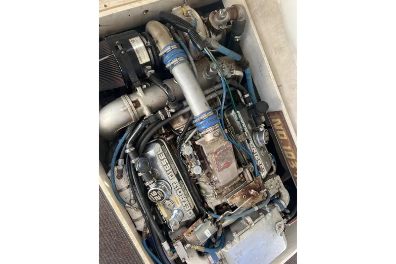 Slide: The Image of Engine of a 1995 Young Brothers 38 Fly Bridge boat, featuring a Detroit Diesel. - 18
