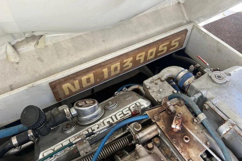 Slide: The Image of Engine compartment of 1995 Young Brothers 38 Fly Bridge with visible serial number. - 19