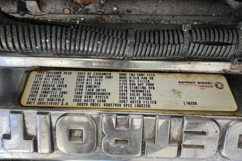 Slide: The Image of Engine label of a 1995 Young Brothers 38 Fly Bridge, featuring Detroit Diesel specifications. - 20