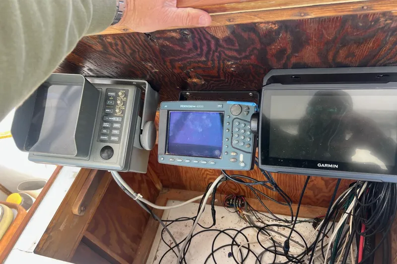 Slide: The Image of Control panel of a 1995 Young Brothers 38 Fly Bridge with navigation equipment. - 22