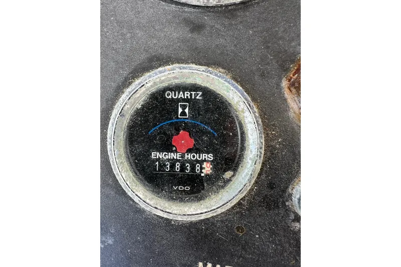 Slide: The Image of Engine hour meter reading 13838 on 1995 Young Brothers 38 Fly Bridge. - 24