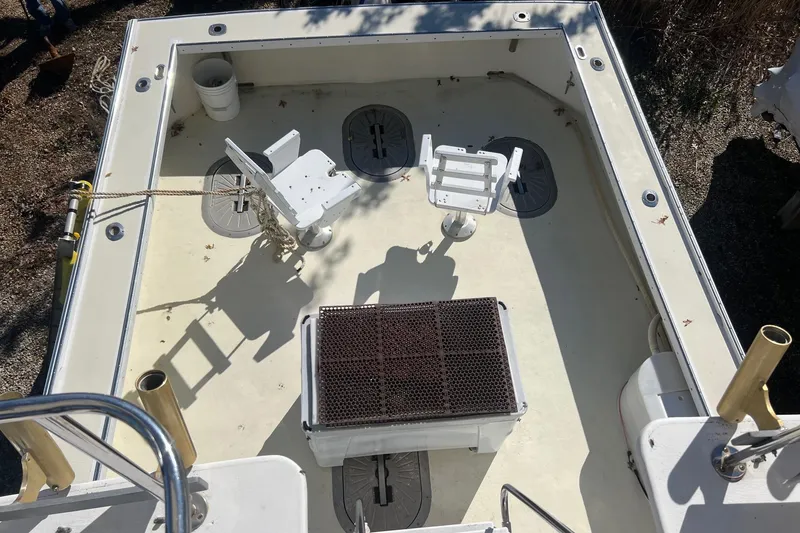 Slide: The Image of Deck view of 1995 Young Brothers 38 Fly Bridge boat with fishing chairs and equipment. - 7