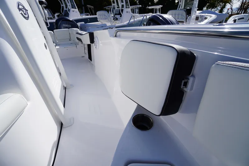 Slide: The Image of 2026 Tidewater 220 LXF boat interior with cushioned seating and sleek design. - 15