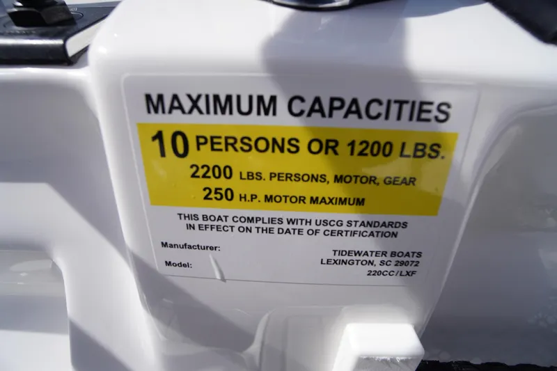 Slide: The Image of 2026 Tidewater 220 LXF capacity label: 10 persons, 1200 lbs, 250 HP motor max. - 29