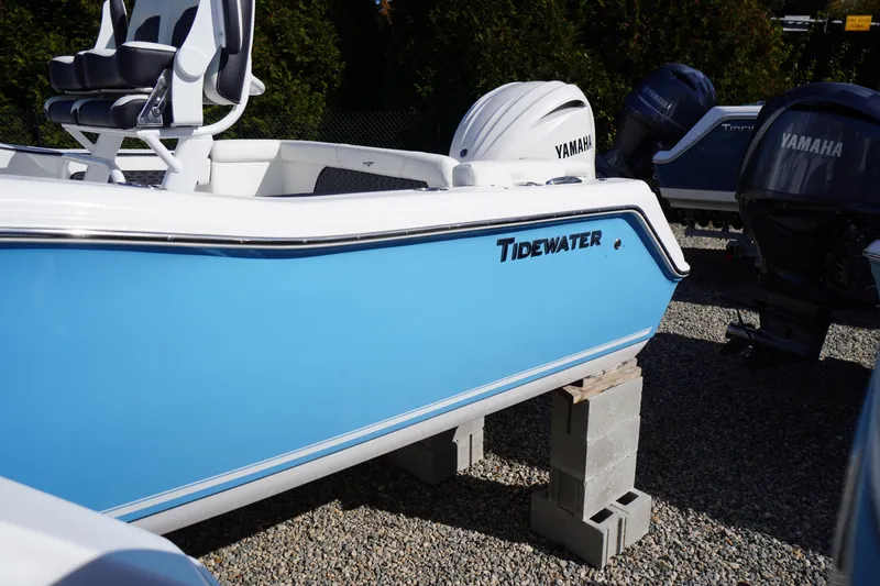 Slide: The Image of 2026 Tidewater 220 LXF boat with Yamaha engine, displayed on blocks. - 3