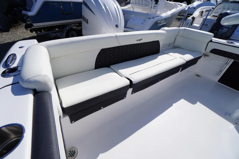 Slide: The Image of 2026 Tidewater 220 LXF boat interior with white cushioned seating and sleek design. - 37