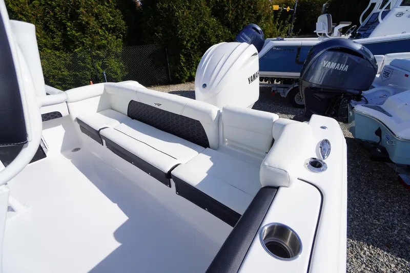 Slide: The Image of 2026 Tidewater 220 LXF boat with Yamaha engine, featuring sleek white seating and modern design. - 39