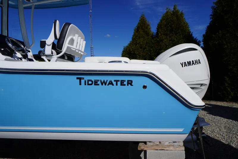 Slide: The Image of 2026 Tidewater 220 LXF boat with Yamaha engine, blue and white design. - 4