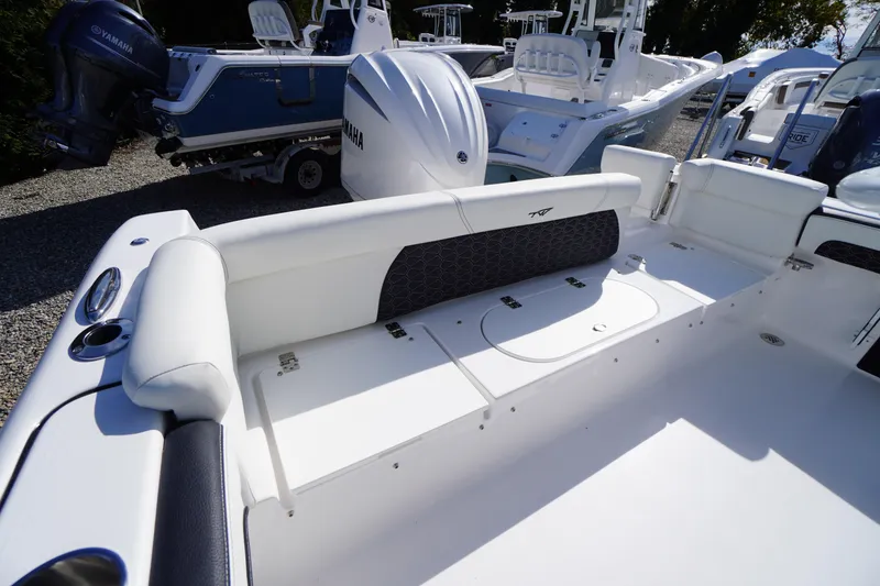 Slide: The Image of 2026 Tidewater 220 LXF boat interior with white seating and Yamaha engine. - 41