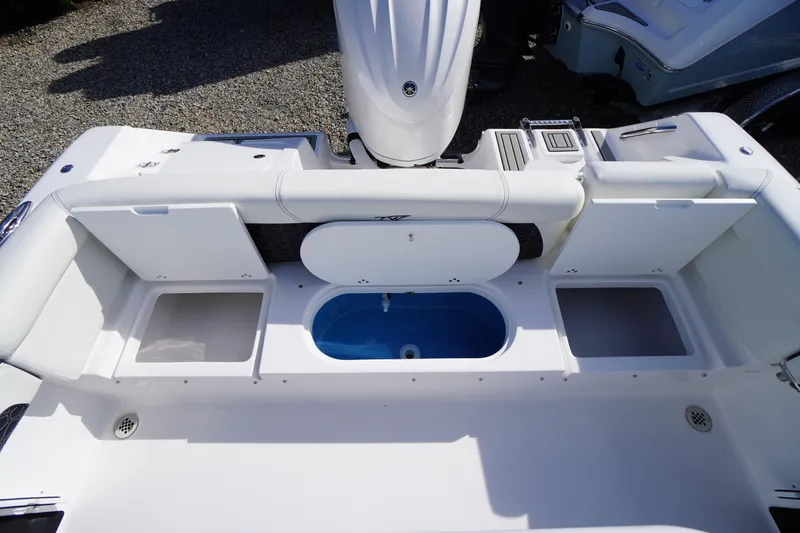 Slide: The Image of 2026 Tidewater 220 LXF boat interior with storage compartments and seating. - 43