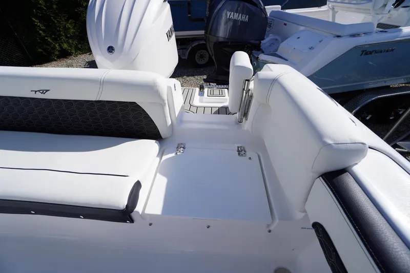 Slide: The Image of 2026 Tidewater 220 LXF boat interior with Yamaha engine, featuring white seating and sleek design. - 45