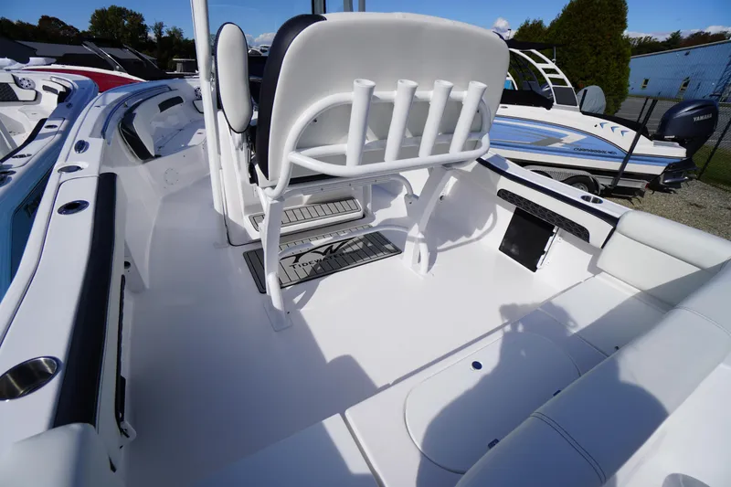 Slide: The Image of 2026 Tidewater 220 LXF boat interior with seating and rod holders. - 47