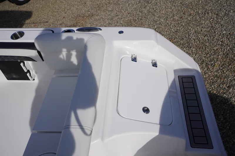 Slide: The Image of 2026 Tidewater 220 LXF boat interior with seating and storage compartment. - 51