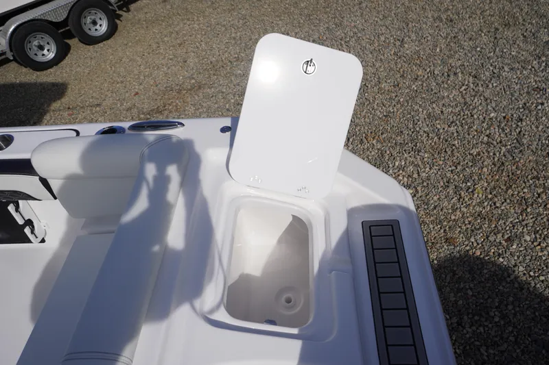 Slide: The Image of 2026 Tidewater 220 LXF boat interior with open storage compartment and seating. - 52