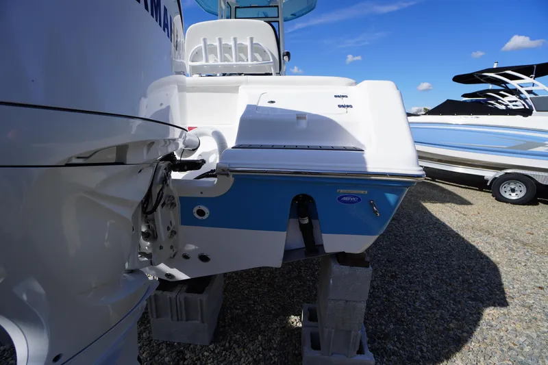 Slide: The Image of 2026 Tidewater 220 LXF boat rear view, showcasing engine and sleek design. - 58