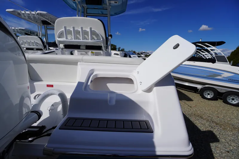 Slide: The Image of 2026 Tidewater 220 LXF boat with open storage compartment, sleek design, and modern features. - 59