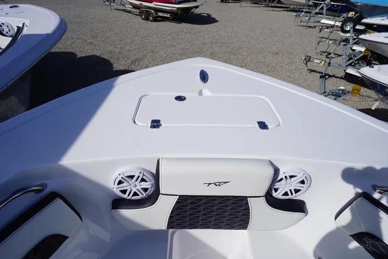 Slide: The Image of 2026 Tidewater 220 LXF boat interior with seating and storage compartment. - 6