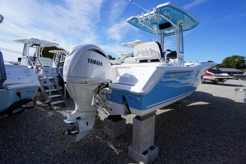 Slide: The Image of 2026 Tidewater 220 LXF boat with Yamaha engine on display outdoors. - 62