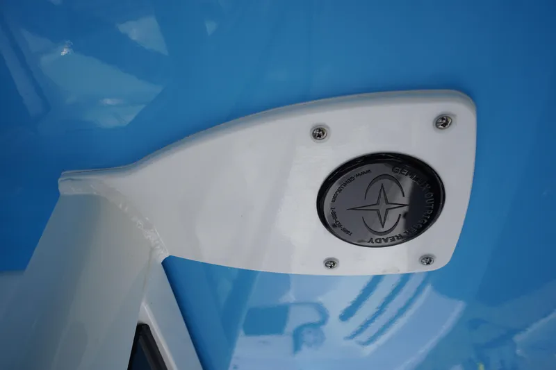 Slide: The Image of Close-up of 2026 Tidewater 220 LXF boat detail with blue and white design. - 66