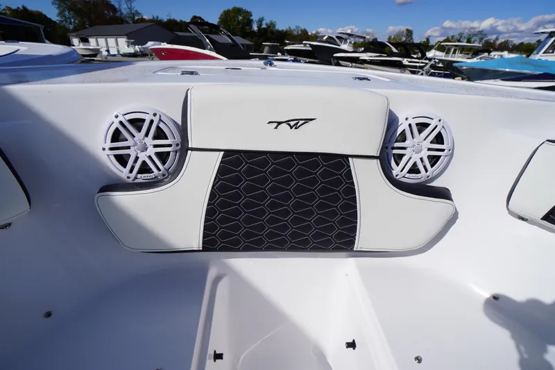Slide: The Image of 2026 Tidewater 220 LXF boat interior with stylish seating and built-in speakers. - 9