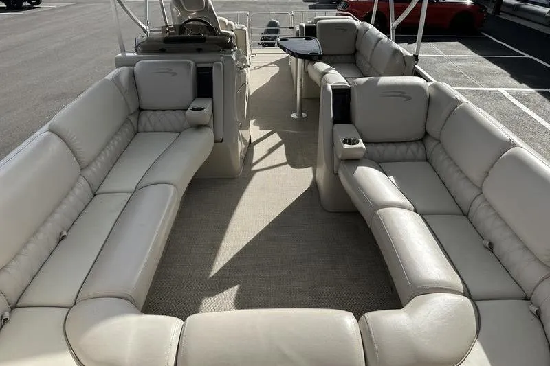 The Image of 2014 Bennington 2575 RCW pontoon boat in showroom, side view. - 1