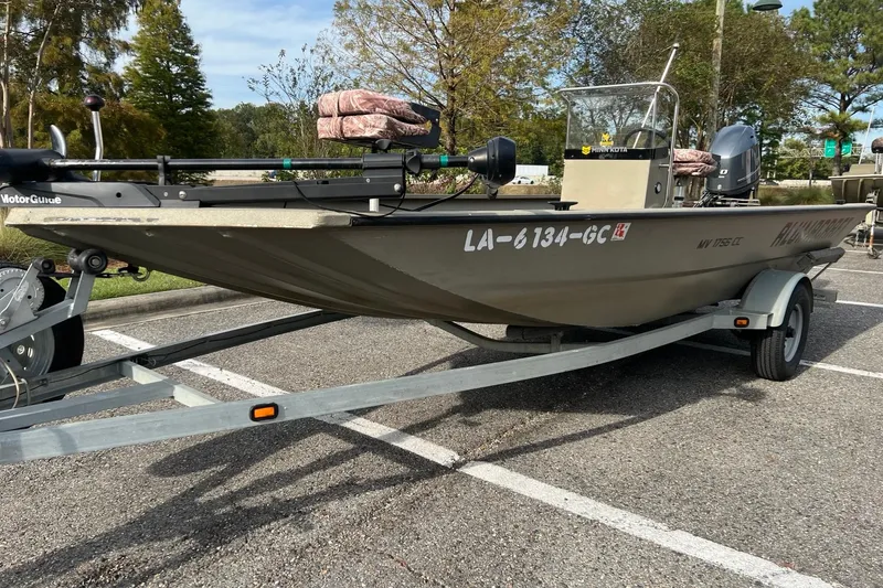 Slide: The Image of 2014 Alumacraft 1756 All Weld MV CC boat on trailer in parking lot. - 3