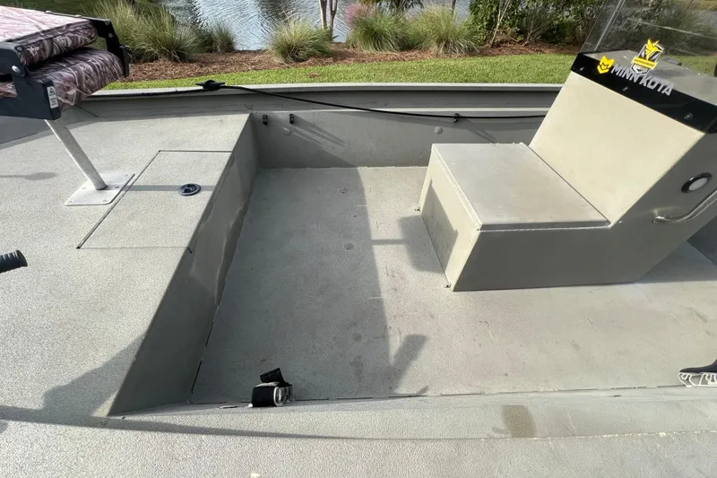 Slide: The Image of 2014 Alumacraft 1756 All Weld MV CC boat interior with seating and storage compartments. - 5