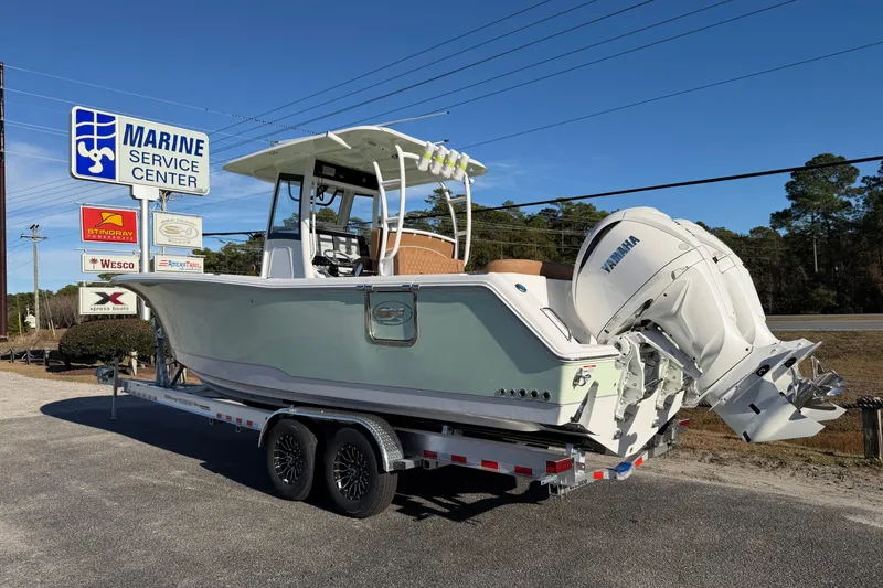 Slide: The Image of 2026 Sea Hunt Ultra 285 Coffin Box boat on trailer at Marine Service Center. - 5