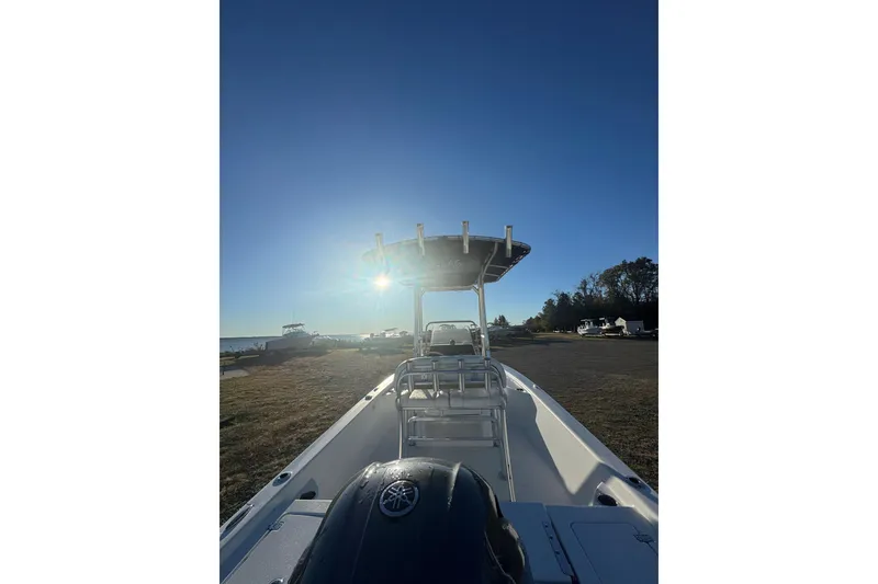 Slide: The Image of 2015 Sportsman Masters 207 Bay Boat on shore with clear blue sky. - 3