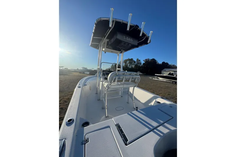 Slide: The Image of 2015 Sportsman Masters 207 Bay Boat with T-top, parked outdoors under clear sky. - 5