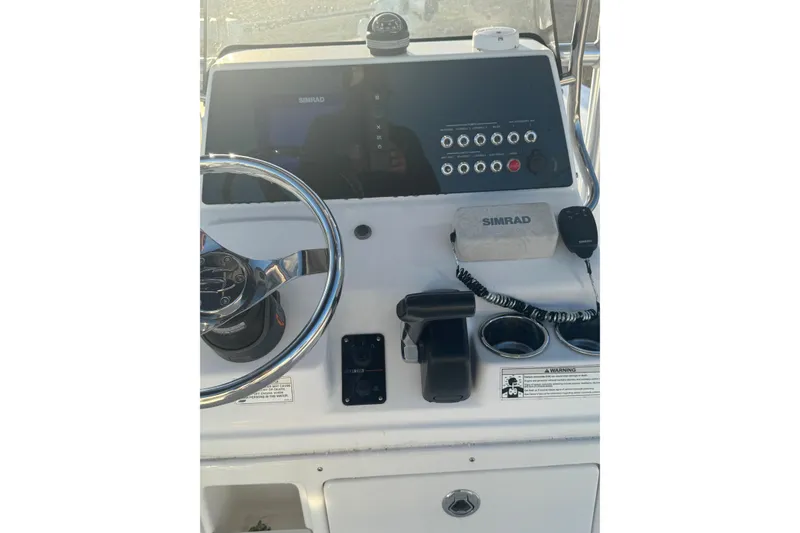 Slide: The Image of Control panel of a 2015 Sportsman Masters 207 Bay Boat with Simrad electronics. - 8