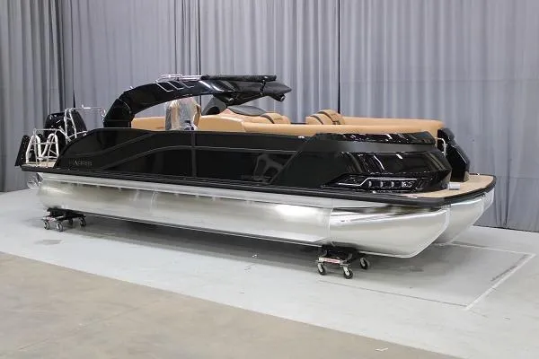 The Image of 2025 Harris Grand Mariner SL 230 pontoon boat in showroom, sleek black design. - 1