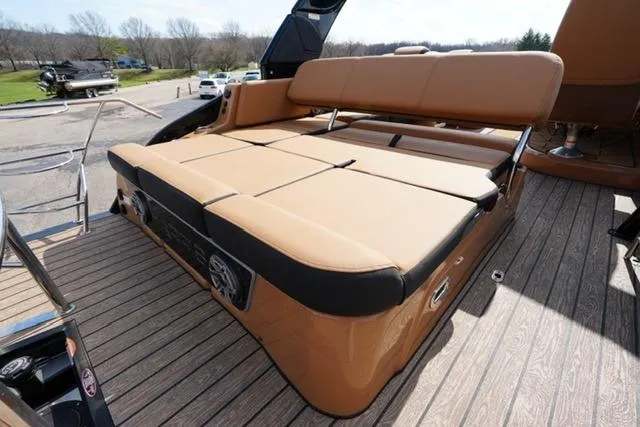 Slide: The Image of 2025 Harris Grand Mariner SL 230 boat with luxurious tan seating on deck. - 14
