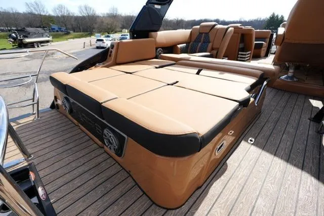Slide: The Image of 2025 Harris Grand Mariner SL 230 boat with luxurious tan seating and deck. - 15