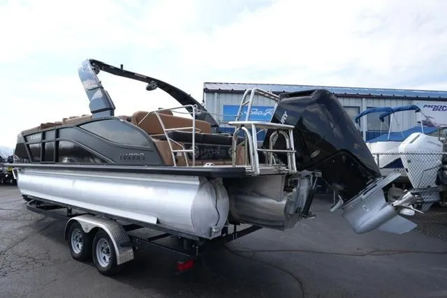 Slide: The Image of 2025 Harris Grand Mariner SL 230 pontoon boat on trailer, rear view. - 5