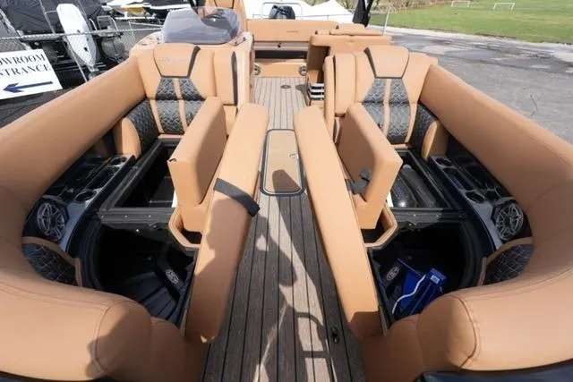 Slide: The Image of 2025 Harris Grand Mariner SL 230 interior with luxurious tan seating and modern design. - 8