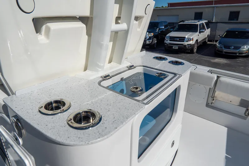 Slide: The Image of 2026 Tidewater 3100 Carolina Bay boat with sleek deck and fishing rod holders. - 10