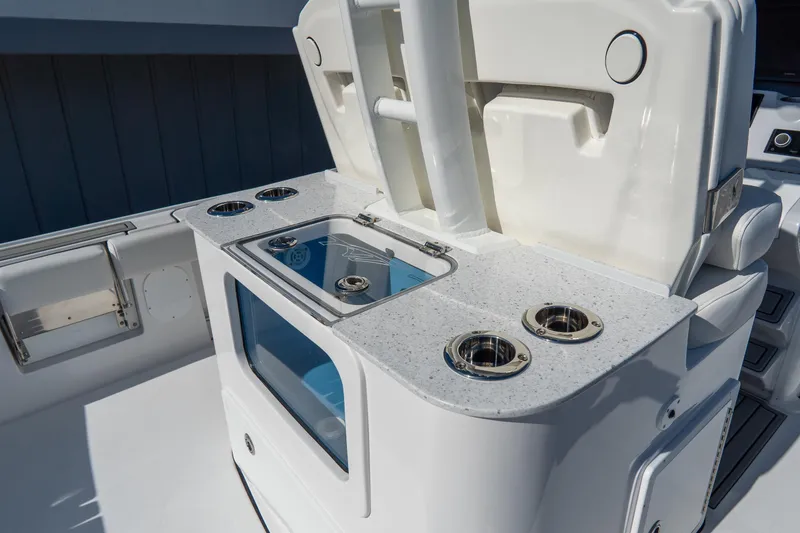 Slide: The Image of 2026 Tidewater 3100 Carolina Bay boat interior with fishing rod holders and storage. - 11