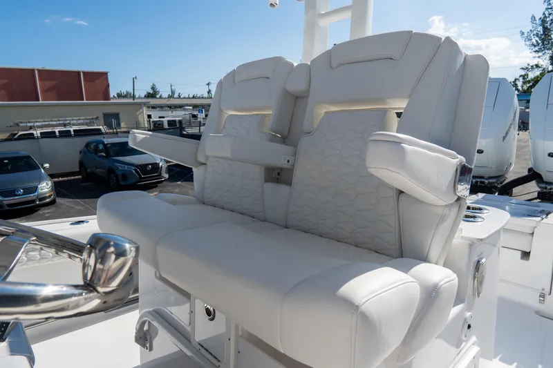 Slide: The Image of Luxurious seating on 2026 Tidewater 3100 Carolina Bay boat, featuring plush white upholstery. - 28
