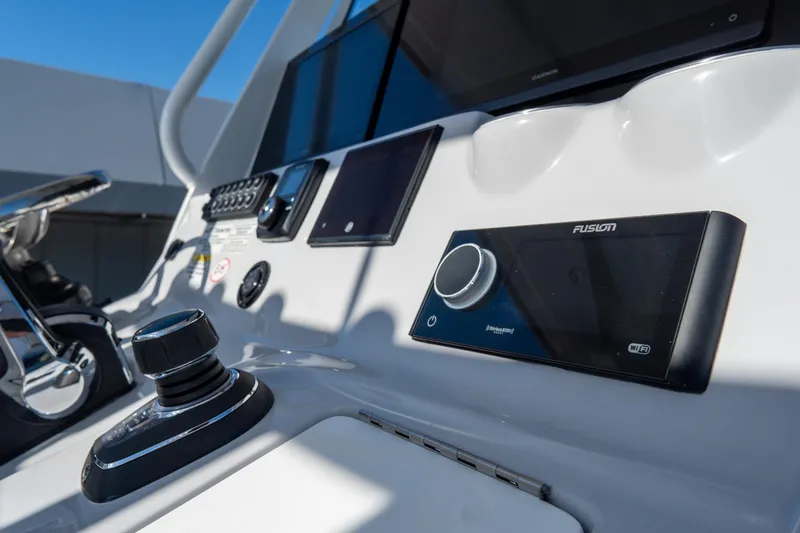 Slide: The Image of Control panel of 2026 Tidewater 3100 Carolina Bay boat with advanced navigation system. - 32