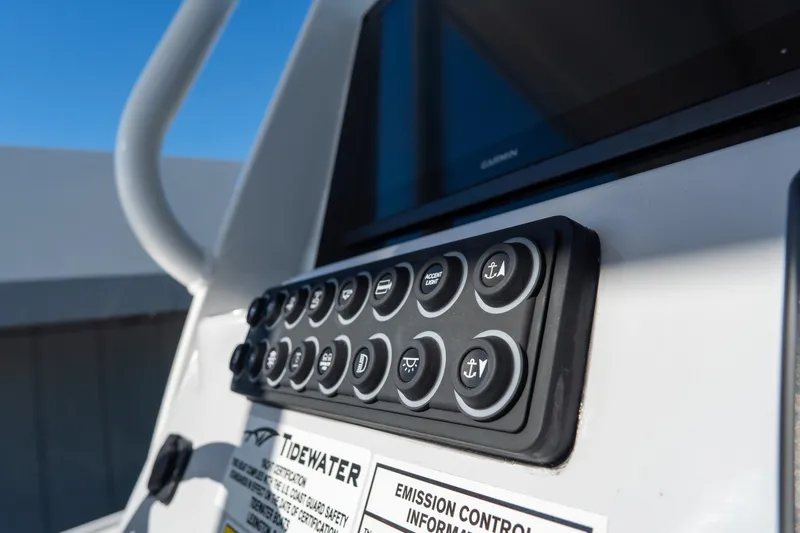 Slide: The Image of Control panel of 2026 Tidewater 3100 Carolina Bay boat with labeled buttons. - 33