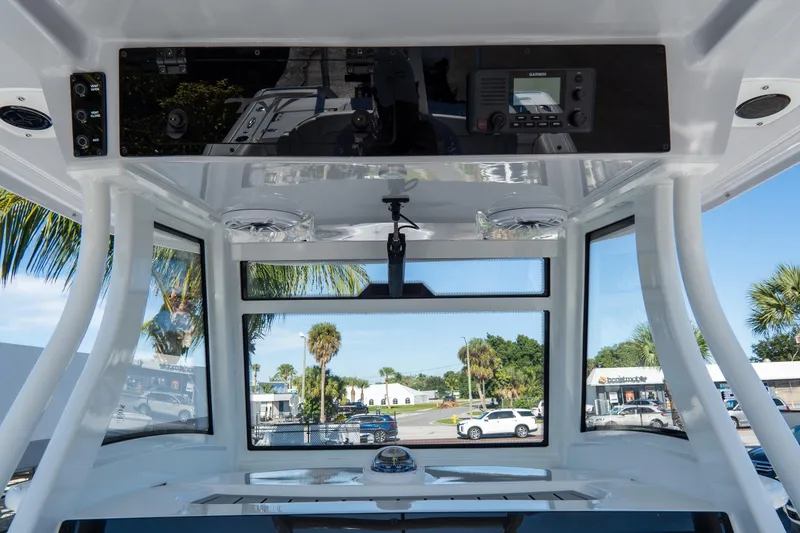 Slide: The Image of 2026 Tidewater 3100 Carolina Bay boat interior with modern dashboard and panoramic windows. - 35