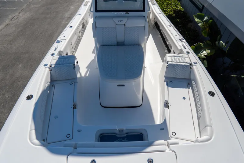 Slide: The Image of 2026 Tidewater 3100 Carolina Bay boat interior with seating and storage compartments. - 47
