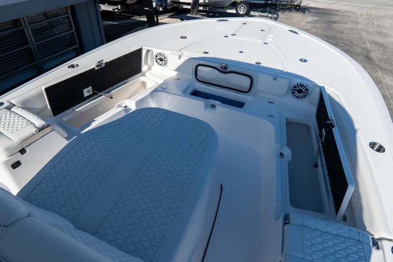 Slide: The Image of 2026 Tidewater 3100 Carolina Bay boat interior with spacious seating and storage compartments. - 48