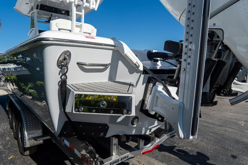 Slide: The Image of 2026 Tidewater 3100 Carolina Bay boat on trailer, showcasing sleek design and modern features. - 5