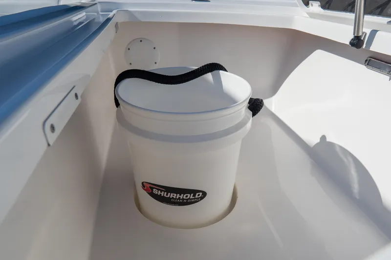 Slide: The Image of White Shurhold bucket in 2026 Tidewater 3100 Carolina Bay boat compartment. - 53