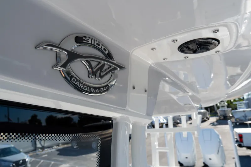 Slide: The Image of 2026 Tidewater 3100 Carolina Bay boat emblem and interior detail. - 62