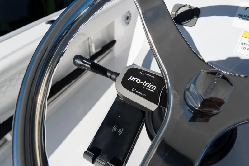 Slide: The Image of Steering wheel and pro-trim control on 2026 Tidewater 3100 Carolina Bay boat. - 63