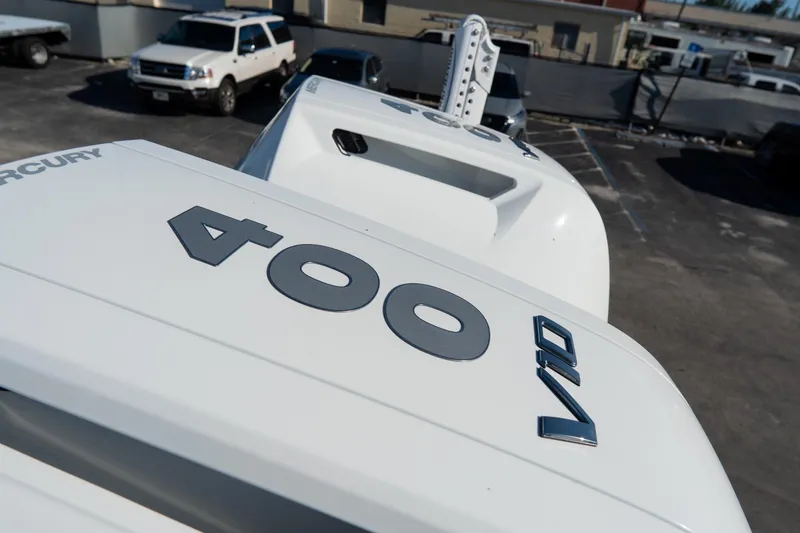 Slide: The Image of 2026 Tidewater 3100 Carolina Bay boat with Mercury 400 V10 engine in parking lot. - 64