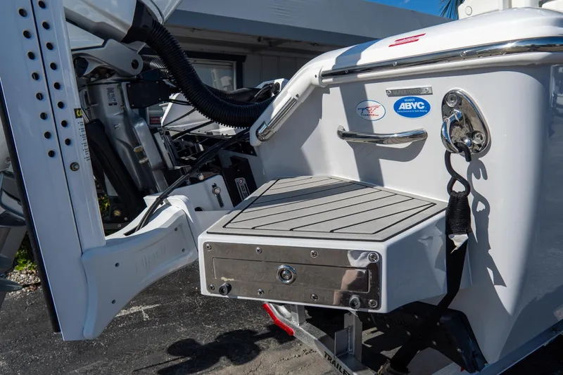 Slide: The Image of 2026 Tidewater 3100 Carolina Bay boat stern with swim platform and safety features. - 7